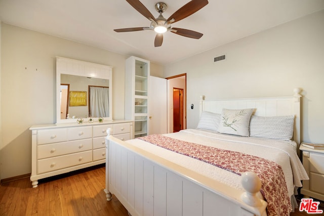 bedroom featuring light wood-type flooring and ceiling fan