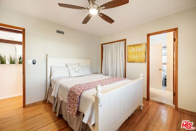 bedroom with ceiling fan and light wood-type flooring