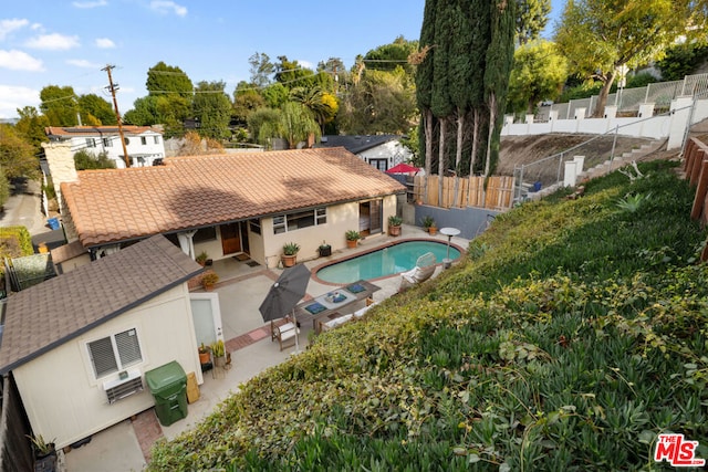 view of swimming pool with a patio