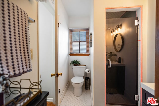 bathroom featuring toilet, tile patterned floors, and walk in shower