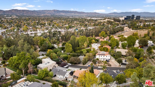 drone / aerial view featuring a mountain view