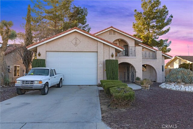 view of front of house with a balcony and a garage