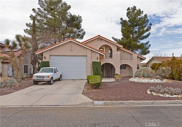 view of front of house with a garage and a balcony