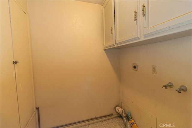 washroom with cabinets and hookup for an electric dryer