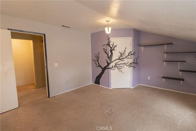 interior space featuring vaulted ceiling and carpet flooring