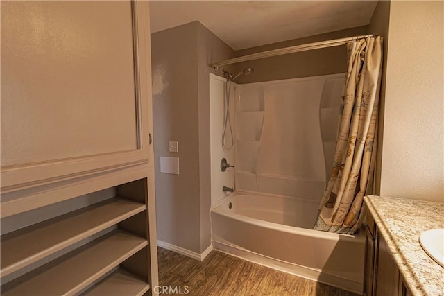 bathroom with vanity, hardwood / wood-style floors, and shower / bathtub combination with curtain