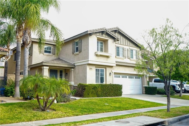 view of front of house with a front lawn and a garage