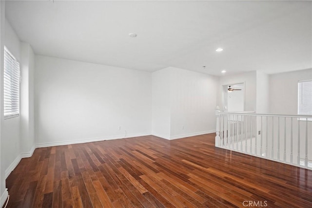 unfurnished room featuring dark hardwood / wood-style flooring and ceiling fan