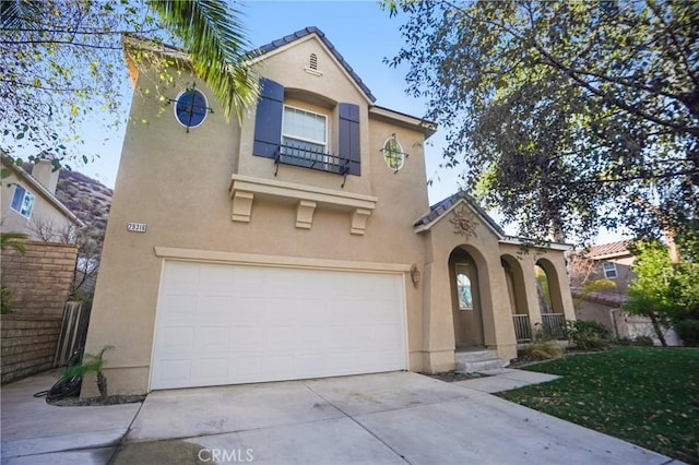 mediterranean / spanish-style home featuring a garage