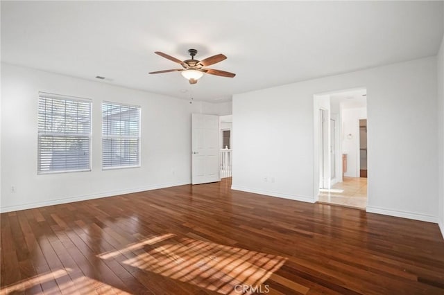 empty room featuring wood-type flooring and ceiling fan