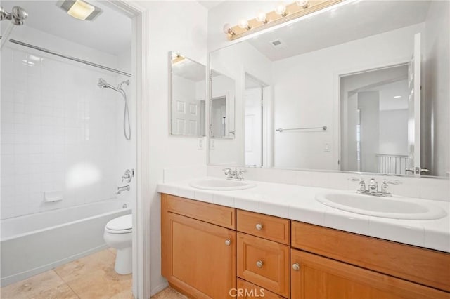 full bathroom featuring tile patterned floors, vanity, toilet, and shower / bathing tub combination