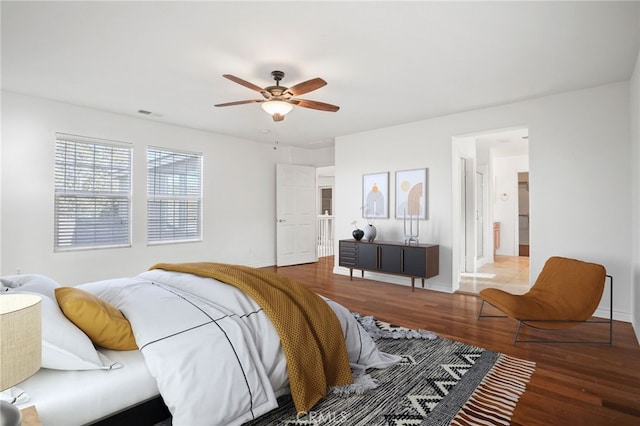 bedroom featuring ceiling fan and wood-type flooring