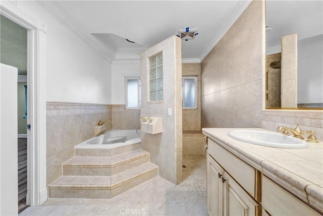 bathroom with vanity, tile patterned floors, separate shower and tub, ornamental molding, and tile walls