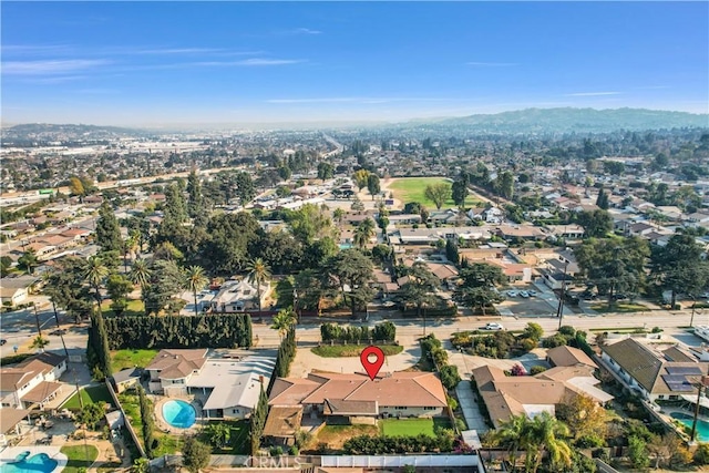 birds eye view of property featuring a mountain view