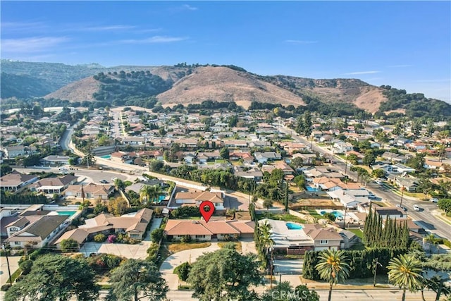 birds eye view of property with a mountain view