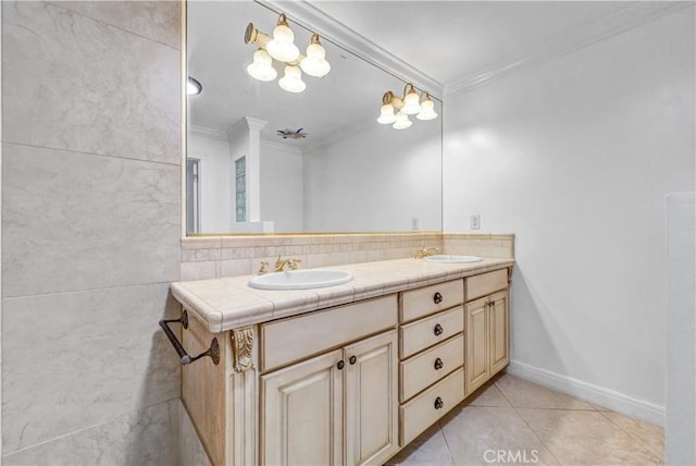 bathroom featuring tile patterned floors, vanity, backsplash, and crown molding