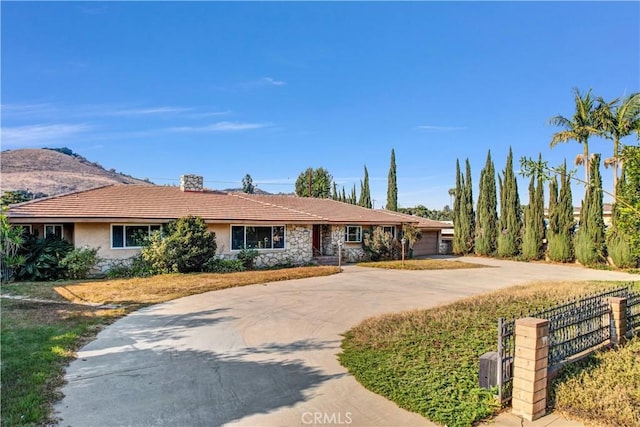 ranch-style home with a mountain view