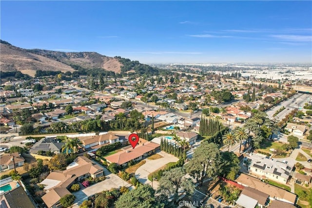 birds eye view of property featuring a mountain view