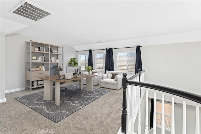 office area featuring lofted ceiling and carpet flooring