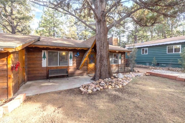 back of property featuring a patio