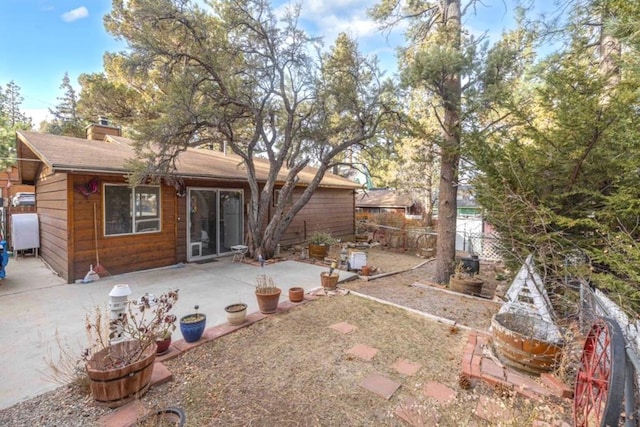 back of house with a patio