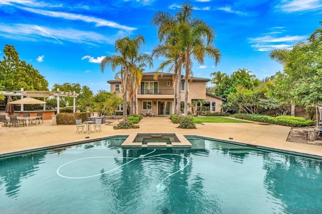 view of swimming pool with an in ground hot tub, a pergola, an outdoor bar, and a patio area