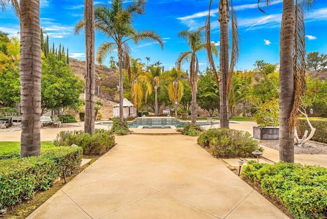 view of home's community with a mountain view and a swimming pool