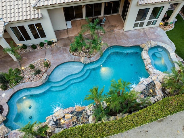 view of pool featuring a patio area