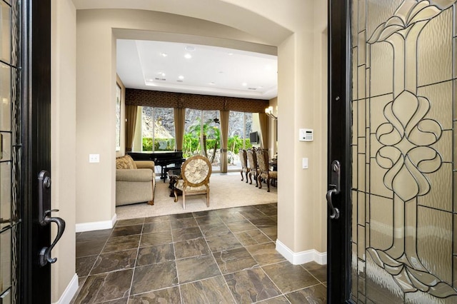 foyer with a chandelier