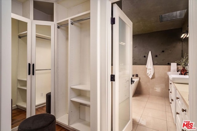 bathroom with vanity and tile patterned flooring