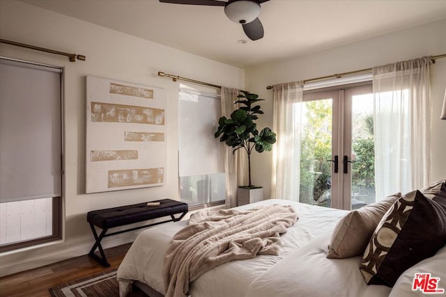 bedroom with ceiling fan, access to exterior, dark hardwood / wood-style flooring, and french doors