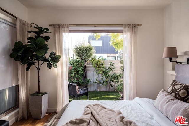 bedroom with wood-type flooring