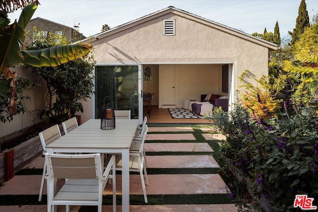 rear view of property featuring a patio area