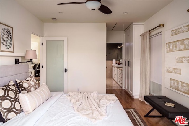 bedroom with ceiling fan, dark hardwood / wood-style floors, and ensuite bathroom