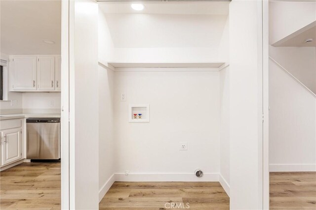 750 Chorro St Unit 5, San Luis Obispo, CA 93401 - washroom with hookup for a washing machine, light wood-type flooring, and baseboards