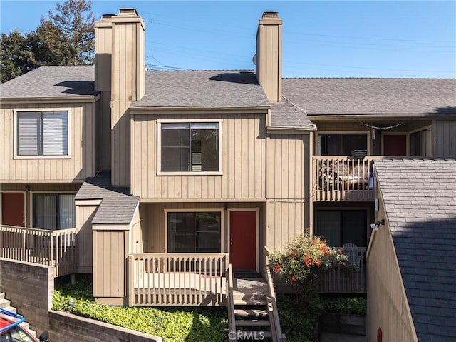 750 Chorro St Unit 5, San Luis Obispo, CA 93401 - view of front of home featuring a chimney, a shingled roof, and a balcony