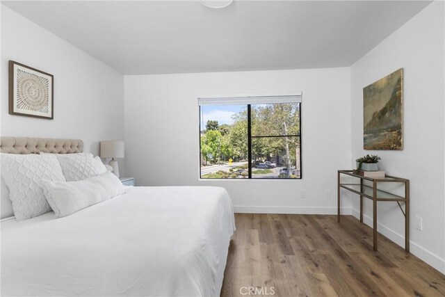 750 Chorro St Unit 5, San Luis Obispo, CA 93401 - bedroom featuring wood finished floors and baseboards