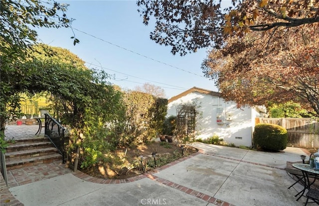 view of side of home with a patio area