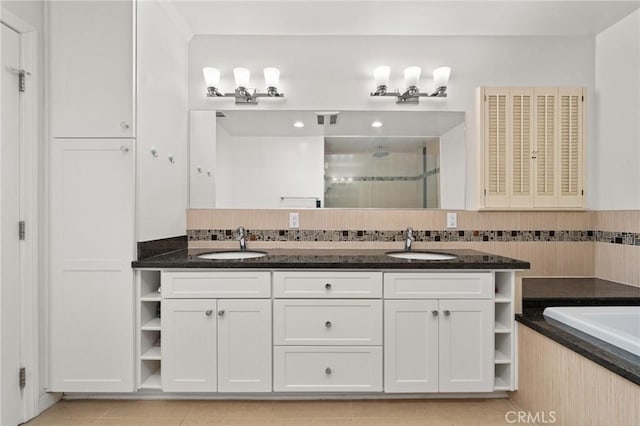 bathroom featuring vanity, tile patterned flooring, and independent shower and bath