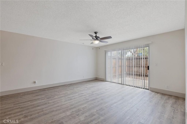 unfurnished room with ceiling fan, light hardwood / wood-style floors, and a textured ceiling