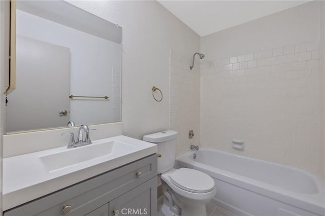 full bathroom featuring toilet, vanity, and  shower combination