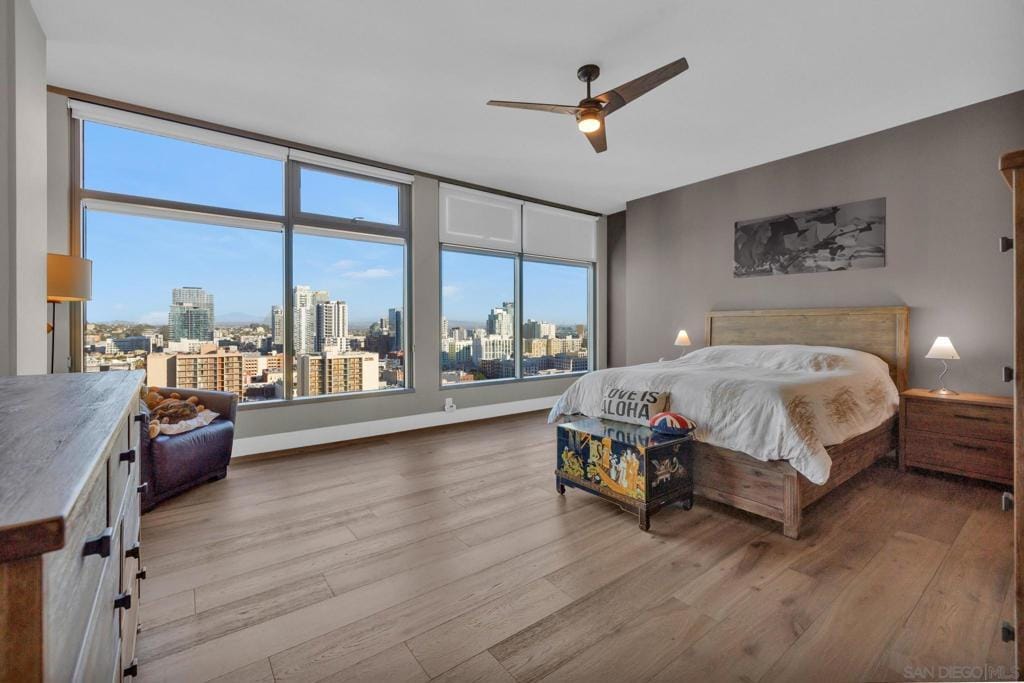 bedroom featuring ceiling fan and light hardwood / wood-style flooring