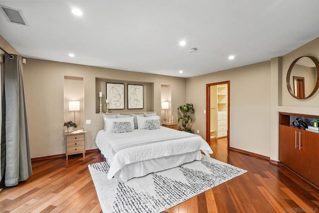 bedroom with hardwood / wood-style floors