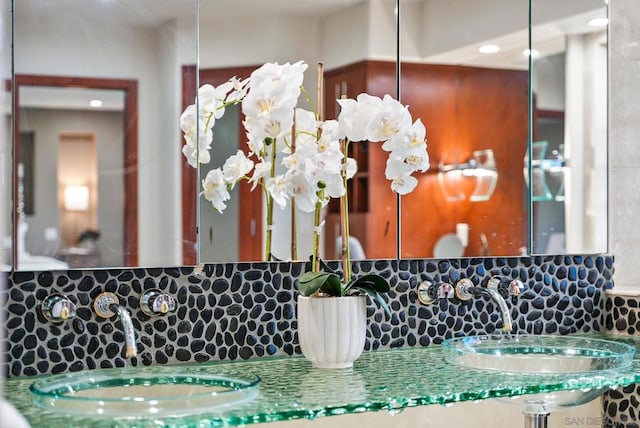 bathroom featuring backsplash and vanity