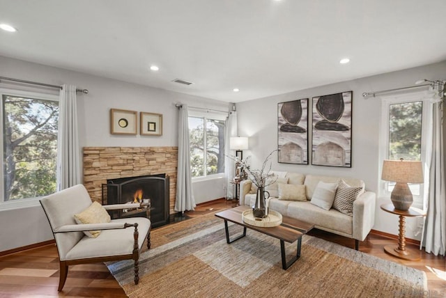 living room featuring hardwood / wood-style flooring and a fireplace