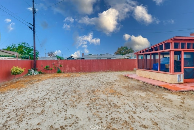 view of yard featuring a sunroom