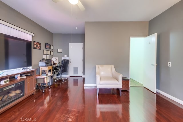 office area with ceiling fan and dark wood-type flooring