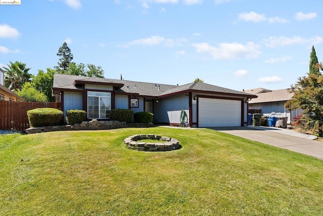 ranch-style house featuring a front lawn and a garage