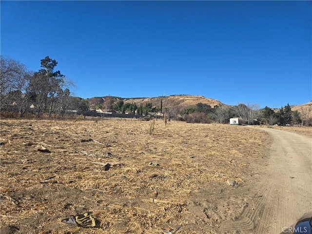 property view of mountains featuring a rural view