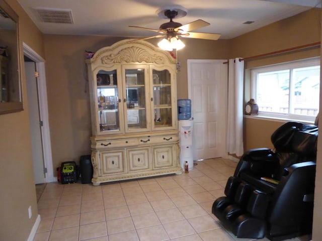 interior space with ceiling fan and light tile patterned floors